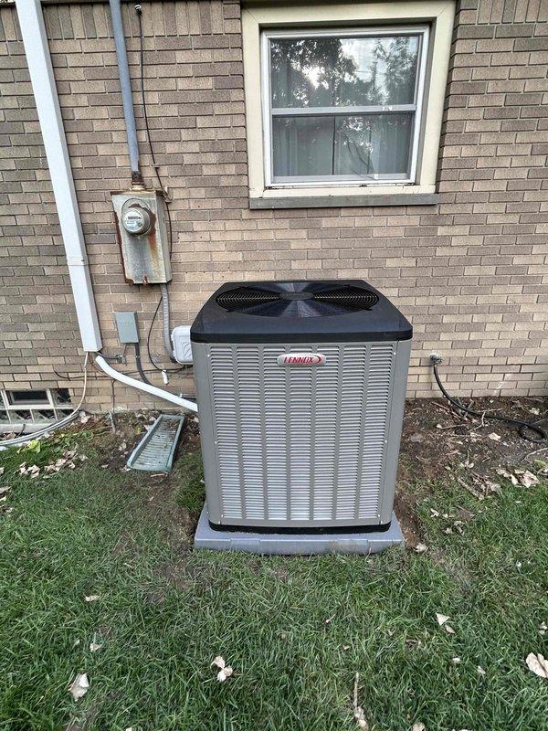 Completed full HVAC system installation including a 70,000 BTU gas furnace and 3-ton air conditioning unit. The outdoor Lennox condenser was positioned on a concrete pad at the rear of the residence against the brick exterior wall, with refrigerant lines properly routed through the wall and connected to the indoor air handler. Installed new air handler in the attic space with control board and electrical connections completed per manufacturer specifications. Ran flexible ductwork from the air handler unit with proper insulation wrapping to ensure efficient airflow throughout the system. All mechanical and electrical connections were secured and tested for proper operation. System startup and commissioning completed successfully with all components functioning within normal operating parameters.