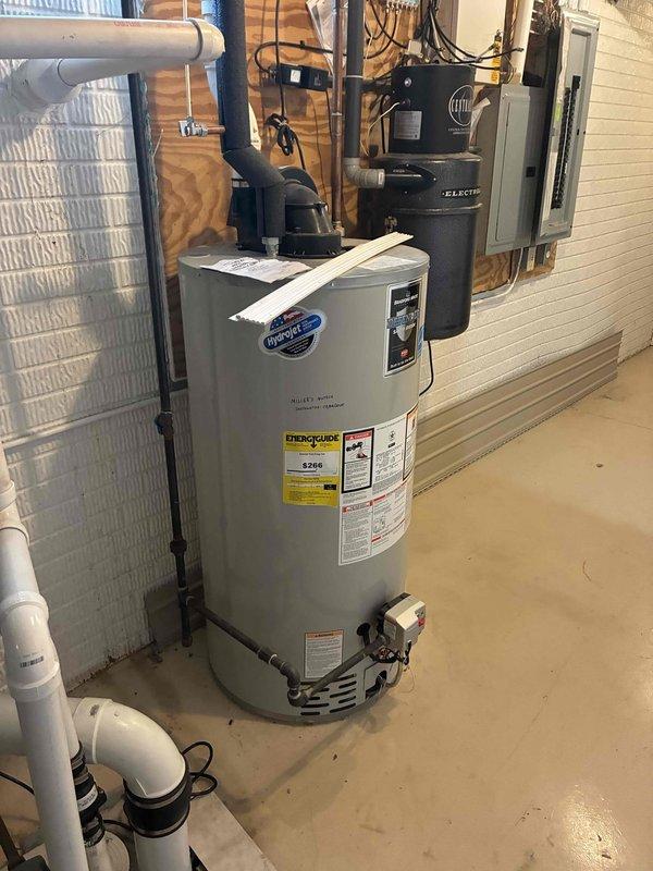 Conducted comprehensive assessment of existing HVAC system and water heater in basement mechanical room for replacement estimate. Documented current equipment configuration including gray metal furnace/air handler unit with associated PVC drainage lines, aluminum flex duct connections, and integrated ductwork system. Evaluated water heater installation and surrounding utility infrastructure including electrical components and plumbing connections. Captured detailed photographic documentation of equipment specifications, manufacturer labels, and existing installation conditions to develop accurate system replacement quote.