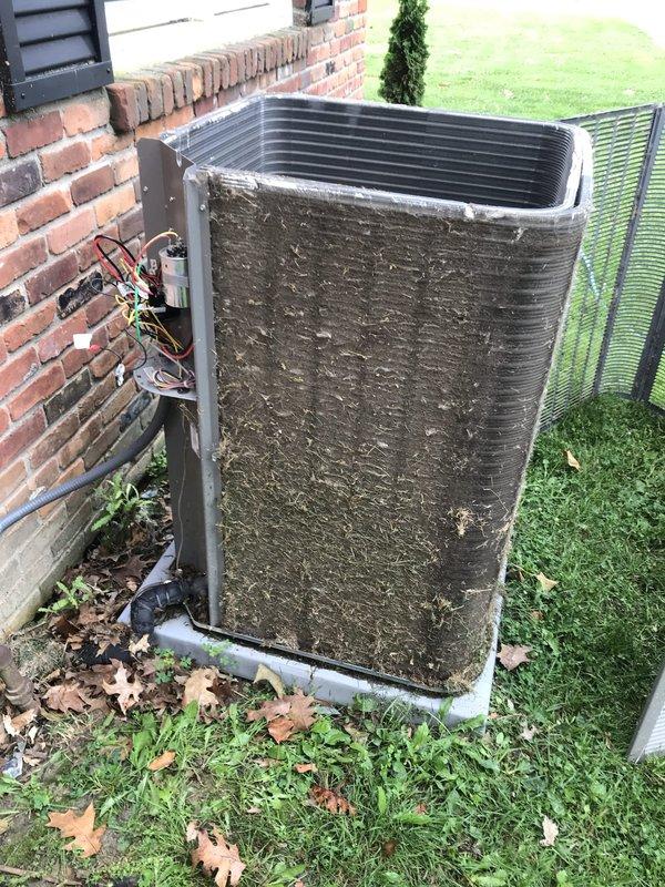 Completed callback maintenance visit on outdoor air conditioning condenser unit. Upon arrival, found unit heavily soiled with accumulated dirt, grime, and debris on exterior panels and coil surfaces from prolonged outdoor exposure. Performed thorough cleaning of condenser coils and exterior surfaces to restore proper airflow and heat transfer efficiency. Unit now operational with improved performance following maintenance completion.