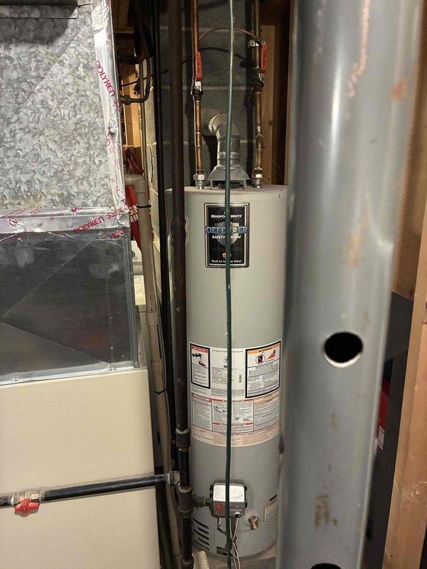Conducted comprehensive estimate for HVAC system replacement in residential basement installation. Upon inspection, diagnosed failed blower wheel bearings in aging furnace unit. Given the advanced age of the existing equipment and extent of mechanical wear, discussed full system replacement options with homeowner. Documented current installation configuration including furnace, water heater, and associated ductwork. Photographed existing equipment layout and mechanical room conditions to support replacement planning and proposal development.