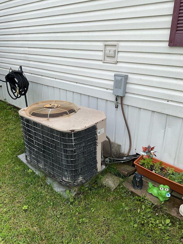 Provided comprehensive replacement estimate for 20-year-old residential air conditioning system that is no longer operational. Evaluated existing outdoor condenser unit and indoor air handler with deteriorating electrical components, documenting current equipment condition and discussing complete system replacement options with appropriate tonnage and efficiency ratings to meet the home's cooling requirements.