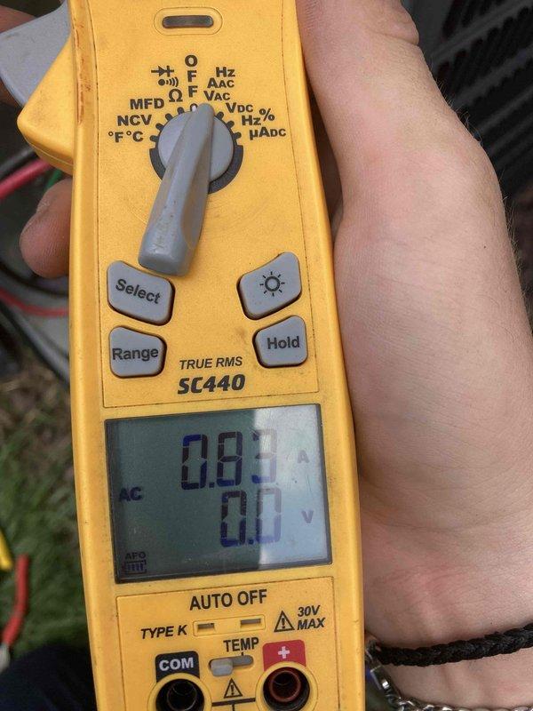 # AC No Cool - Capacitor Failure

Responded to service call for air conditioning system not cooling. Upon inspection, diagnosed failed dual run capacitor in condensing unit. Tested capacitor with multimeter showing 0.81 microfarads, significantly below rated specification. Replaced defective capacitor with properly rated component, verified all electrical connections secure, and confirmed system returned to normal cooling operation.