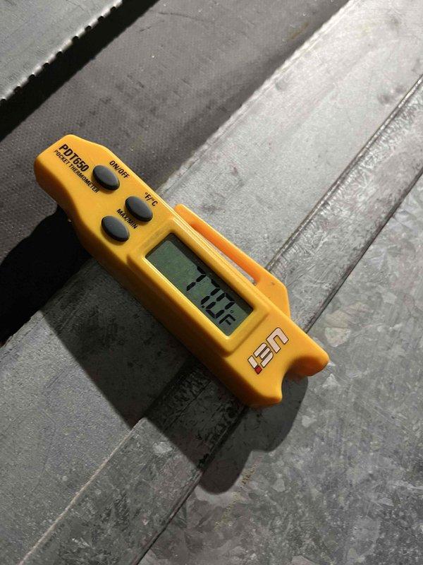 Responded to no cooling complaint on air conditioning system over 10 years old. Upon arrival, performed diagnostic testing using digital temperature measurement equipment to assess system performance and identify the root cause of the cooling failure. Documentation captured showing diagnostic tools and testing procedures utilized during the service call.