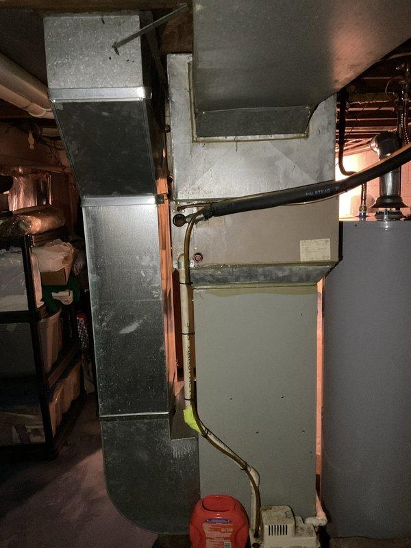 Completed comprehensive assessment of existing HVAC system and electrical infrastructure for replacement estimate. Documented current basement mechanical room configuration including ductwork system, water heater, and HVAC components, and evaluated electrical panel capacity with existing solar integration and dedicated HVAC circuits to determine compatibility requirements for new equipment installation.