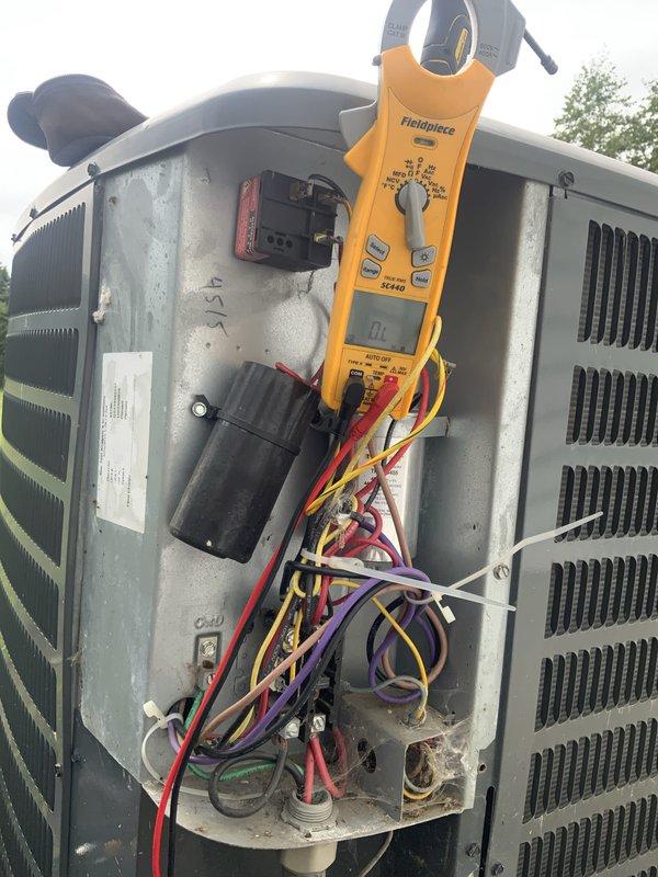 # HVAC Service Completed

Responded to no cooling complaint on residential central air conditioning system. Upon arrival, performed visual inspection of outdoor condensing unit and accessed electrical compartment. Utilized Fieldpiece clamp meter to diagnose electrical issues and measure amperage draw on compressor circuit.

Inspection revealed failed contactor with severely oxidized and corroded brass terminal connections. Contactor showed visible signs of wear, pitting on contact surfaces, and electrical arcing damage. Oxidation on terminal screws indicated prolonged exposure to moisture and environmental elements, causing poor electrical connectivity and preventing compressor from engaging properly.

Replaced defective contactor with new unit rated to manufacturer specifications. Cleaned all electrical terminal connections, removed oxidation buildup, and ensured proper wire seating at all connection points. Verified all wire insulation integrity and secured connections with appropria
