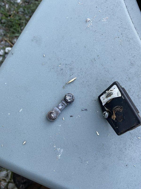 Responded to no cooling call on aging air conditioning system. Upon inspection, discovered severely burned and damaged contactor with extensive heat damage and charring, indicating electrical failure. Removed failed contactor and replaced with new unit. Verified all electrical connections at terminal block were secure and properly torqued. System tested and confirmed operational with normal cooling restored.