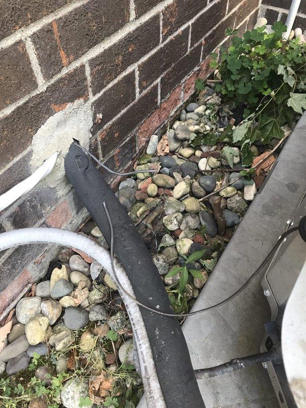 Responded to no-cool call on 9-year-old central air conditioning system. Upon arrival, found accidental damage to electrical wiring connecting outdoor condenser unit to main power supply. Inspected cut wiring at exterior unit location and verified extent of damage to conductor insulation and copper strands. De-energized system at disconnect and assessed wire gauge and connection points. Repaired damaged section of electrical wiring using approved splicing methods and weatherproof connectors rated for outdoor HVAC applications. Verified proper wire sizing and secure terminations at both unit disconnect and condenser connection point. Restored power to system and tested unit operation. Confirmed compressor startup, verified proper amperage draw, and ensured condenser fan motor engaged correctly. System returned to normal cooling operation with no fault codes present.