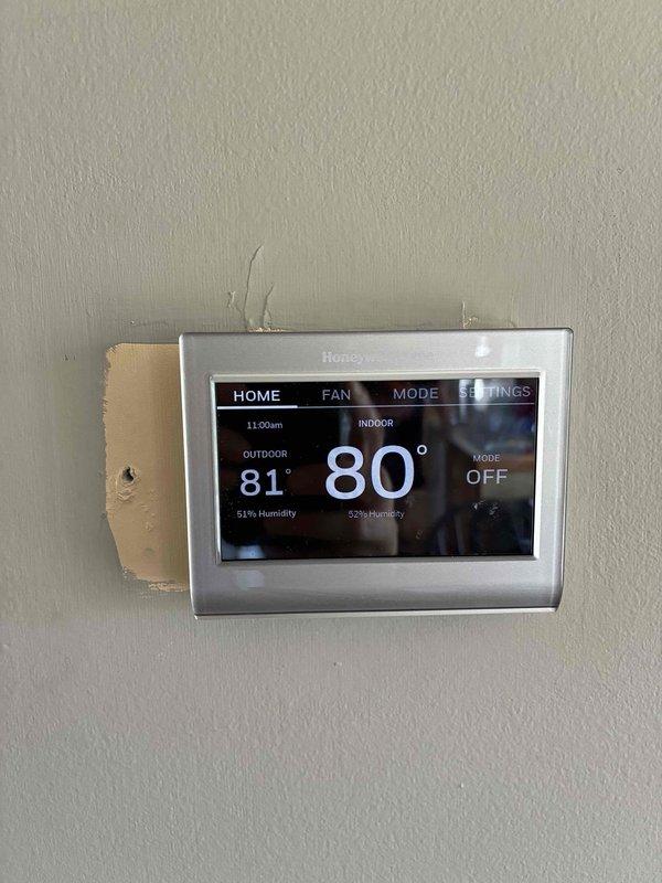 Conducted on-site evaluation of aging HVAC system for full unit replacement estimate. Assessed existing equipment condition, documented current thermostat (Honeywell digital model displaying 80° indoor temperature at time of inspection), and reviewed electrical panel configuration including furnace circuit breaker location. Customer expressed desire to invest in complete system replacement rather than repair aging equipment. Provided comprehensive assessment and replacement recommendations for new HVAC unit installation.