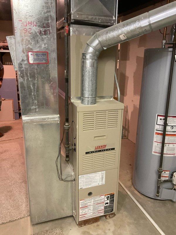 Conducted site assessment for replacement of 21-year-old HVAC system in 1400 square foot single family home. Evaluated existing Lennox furnace and outdoor condenser unit, both currently operational but nearing end of service life. Documented equipment specifications, ductwork configuration, and installation conditions in basement mechanical room and exterior location. Photographed current system setup including furnace with metallic ductwork, plenum assembly, and outdoor condenser unit with protective wire guard and electrical disconnect. Reviewed customer requirements for high-efficiency replacement system including 96% AFUE furnace with integrated humidifier. Prepared comprehensive estimate for Trane equipment installation as requested, accounting for existing infrastructure, clearances, ventilation requirements, and electrical connections to support proactive system upgrade.