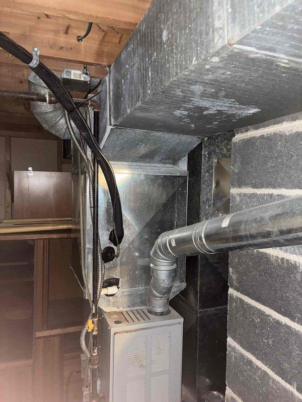 Conducted on-site estimate for complete HVAC system replacement. Documented existing furnace unit located in basement utility area and photographed outdoor gas meter assembly and connections. Recorded model and serial numbers from both furnace and air conditioning components to provide accurate replacement equipment specifications and pricing options for customer consideration.