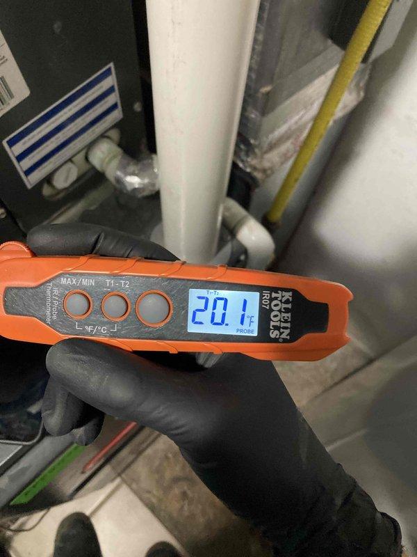 Completed scheduled maintenance agreement visit for air conditioning system. Performed diagnostic testing using digital thermometer to measure temperature differential, recording 20.1°F across the system. Utilized clamp meter to verify electrical performance, confirming 498-volt reading and system amperage within normal operating parameters. Inspected condensate drainage system, ductwork insulation, and air handler components. All equipment found operating properly with no deficiencies noted during inspection.