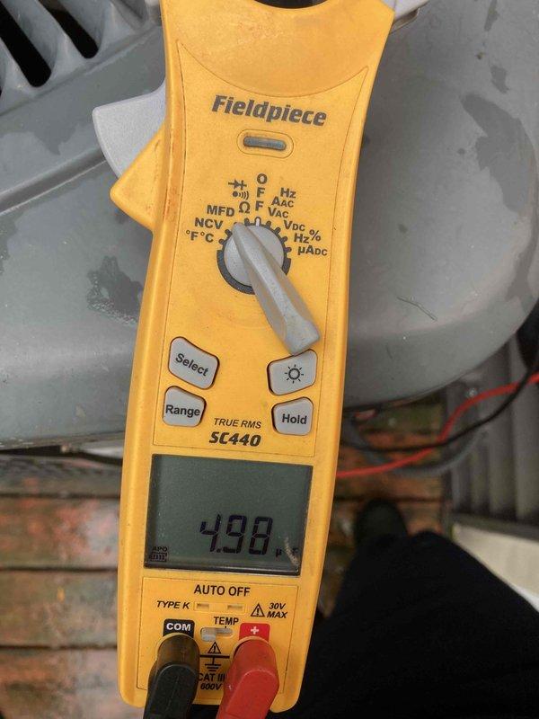 Completed scheduled maintenance agreement visit for air conditioning system. Performed diagnostic testing using digital thermometer to measure temperature differential, recording 20.1°F across the system. Utilized clamp meter to verify electrical performance, confirming 498-volt reading and system amperage within normal operating parameters. Inspected condensate drainage system, ductwork insulation, and air handler components. All equipment found operating properly with no deficiencies noted during inspection.