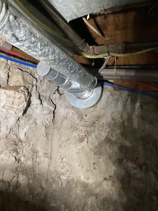 Responded to service call to verify furnace venting configuration prior to planned chimney removal during roof work. Conducted thorough inspection of basement mechanical systems and documented all venting arrangements. Confirmed that the furnace utilizes PVC direct vent system independent of the masonry chimney, while the atmospheric water heater currently vents through the existing chimney flue. Photographed all relevant mechanical equipment, ductwork routing, and venting connections to provide clear documentation for the roofing contractor and homeowner. Advised that the gas-fired water heater will require alternative venting solution or replacement with direct-vent or power-vent unit before chimney can be safely removed, as current atmospheric draft configuration is dependent on the chimney stack.