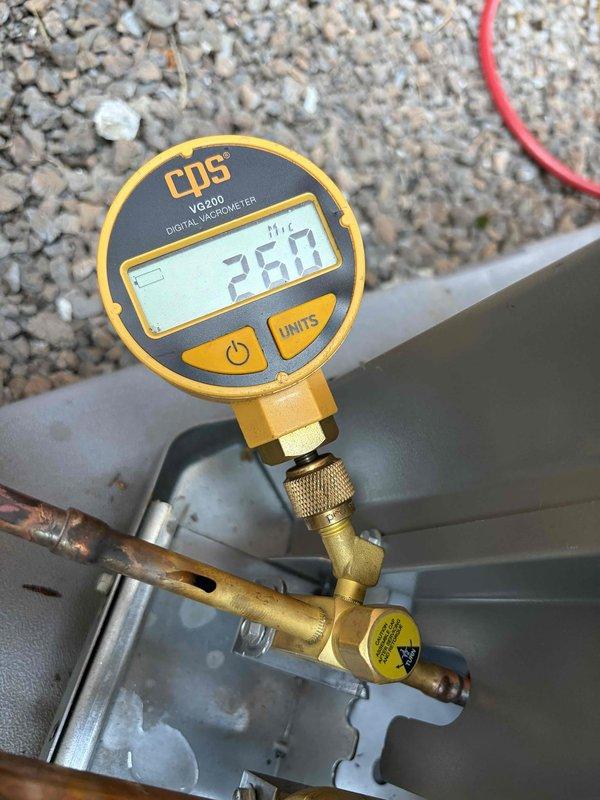 Completed installation of 3.5-ton air conditioning system with evaporator coil, including mechanical and electrical connections to existing furnace unit. System was evacuated to proper vacuum levels (26.7 microns verified with digital gauge), refrigerant lines were connected and secured, and electrical disconnect was wired per code requirements.