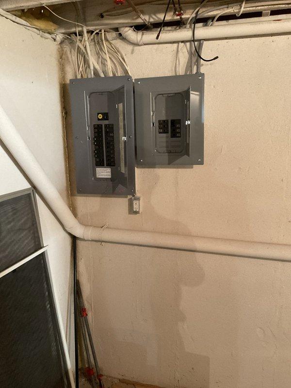 Conducted site assessment for whole home Kohler generator installation. Evaluated existing electrical infrastructure including dual breaker panel configuration in basement utility area and available ceiling space for potential transfer switch routing. Documented current electrical service capacity, panel locations, and HVAC equipment positioning to determine optimal generator placement and connection requirements for seamless integration with residential electrical system.