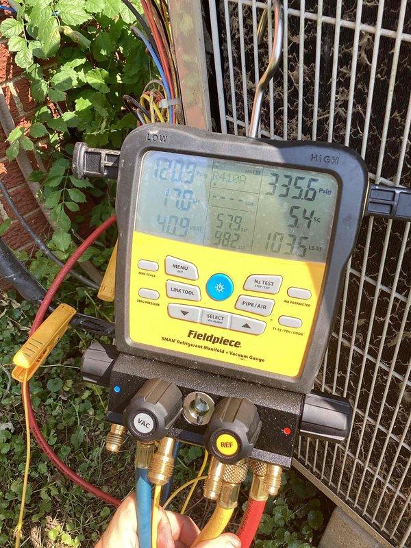 # HVAC Service Report

Responded to no cooling complaint on residential air conditioning system. Upon arrival, connected manifold gauges and found system operating with abnormally high head pressure of 336.6 psig, indicating potential refrigerant overcharge or airflow restriction. Utilized Fieldpiece SMAN digital manifold to diagnose system performance and refrigerant scale to verify proper system charge levels and make necessary adjustments to restore proper cooling operation.
