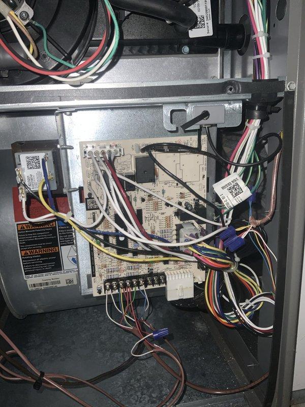 Responded to no heat call on residential furnace approximately 2 years old. Upon arrival, discovered water leakage issue around furnace base, with increased leaking during air conditioning operation indicating condensate drainage problem. Inspected condensate pump system and drain pan assembly, removed access panels to examine control board and internal components for any water damage or electrical issues that could affect heating operation. Documented condensate pump condition and drainage system components with photos showing drain pan area and control board assembly to verify no moisture intrusion affecting furnace controls. Unit currently maintaining cooling function but requires condensate pump repair or replacement to resolve water leakage and restore proper drainage, preventing potential future heating system failures due to safety switches or water damage.