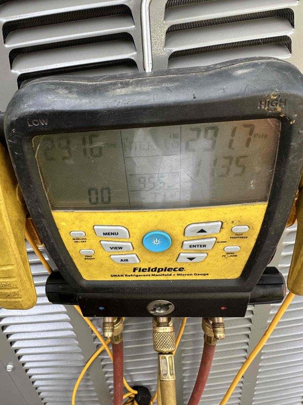 Completed full HVAC system installation including a 70,000 BTU gas furnace, 2-ton air conditioning unit with rear discharge configuration, and whole-home humidifier. Performed all mechanical and electrical connections, verified proper refrigerant charge using manifold gauges and micron gauge for system evacuation, and reconnected electrical circuits. System tested and operational with thermostat controls mounted and functioning correctly.