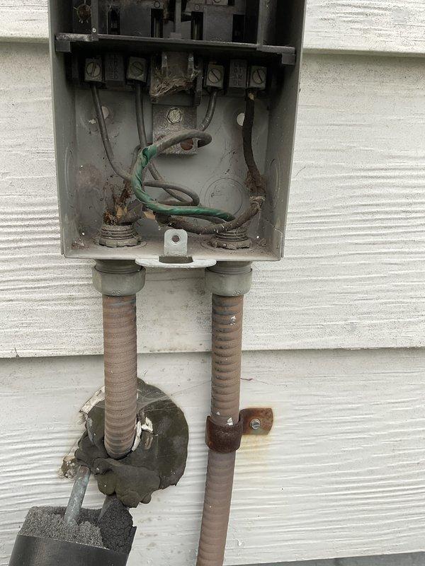 # HVAC Service Report

## Summary
Responded to no-cooling call on 10+ year old outdoor AC unit with non-operational condenser fan. Diagnosed and replaced failed dual run capacitor, restoring proper fan operation and cooling function to the system.

## Work Performed

Upon arrival, confirmed condenser fan motor was not running while compressor attempted to operate. Performed visual inspection of outdoor unit, noting significant age-related wear and weathering on cabinet and components. 

Opened service panel and accessed electrical components. Used multimeter to test dual run capacitor, which showed complete failure with no capacitance reading on fan circuit. Capacitor exhibited visible signs of deterioration consistent with age and outdoor exposure.

Verified electrical supply at disconnect box mounted on exterior wall. Inspected disconnect switch and wiring connections, noting corrosion on conduit penetrations but functional disconnect operation. Confirmed proper voltage supply to uni