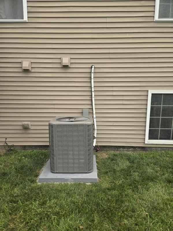 Completed mechanical installation of 3-ton air conditioning system at rear of residence. Installed outdoor condensing unit on concrete pad with proper clearances from structure, connected refrigerant lines, and established condensate drainage via PVC piping routed vertically along exterior siding. Reconnected system to existing Trane XR80 furnace with appropriate electrical connections and verified proper integration between indoor and outdoor components. All refrigerant lines, electrical connections, and condensate drainage systems installed per manufacturer specifications and code requirements.