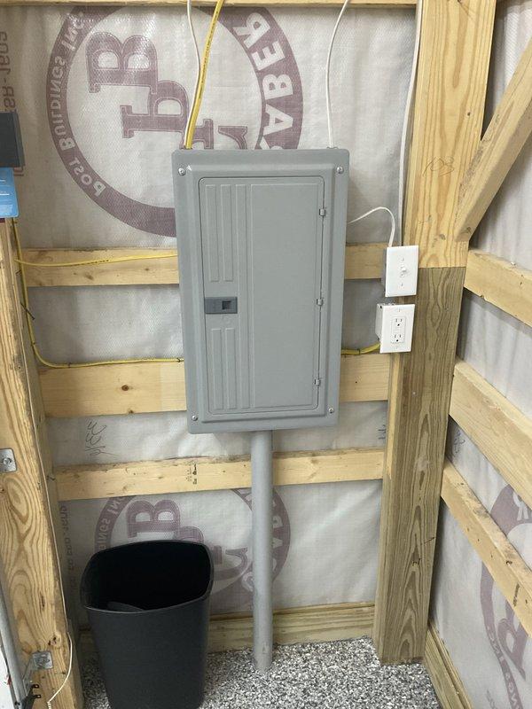 Provided estimate for new HVAC system installation in detached barn structure. Assessed barn interior with exposed wooden framing, electrical panel, and finished epoxy flooring to determine equipment placement and ductwork routing requirements. Recommended appropriate cooling system sizing and configuration for the workshop space to ensure adequate climate control for the structure.