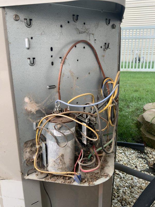 Responded to no-cool call on 20-year-old central air conditioning system with non-operational condenser fan. Upon inspection, diagnosed failed dual run capacitor preventing compressor and fan motor operation. Replaced defective capacitor with OEM-equivalent component rated to manufacturer specifications. Verified proper voltage supply, tested both compressor and condenser fan motor startup, confirmed adequate amperage draw on both circuits, and restored system to normal cooling operation.