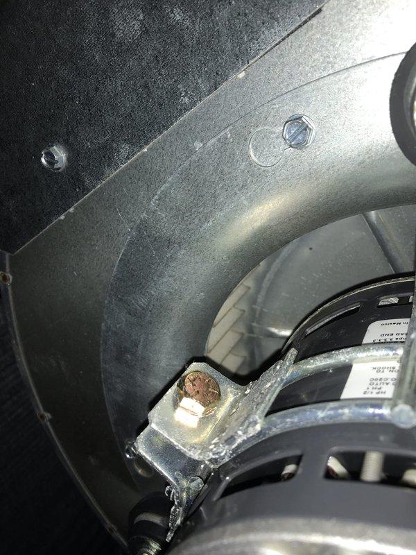 Completed return warranty visit to HVAC system. Performed diagnostic testing with multimeter on blower motor assembly and electrical connections. Inspected and addressed corroded motor mounting bracket showing significant oxidation. Verified proper blower operation and electrical integrity of control panel connections. System tested and operational upon departure.