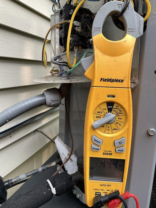 Responded to no cooling complaint on residential air conditioning system approximately 2-3 years old. Upon arrival, verified thermostat set to 72°F with indoor temperature reading 83°F and rising. Performed diagnostic evaluation of outdoor condensing unit, accessing electrical control panel to inspect compressor, capacitors, contactors, and associated wiring. Utilized clamp meter to measure electrical parameters including voltage, amperage, and capacitance values at disconnect box and control board. Identified system malfunction preventing compressor operation. Documented equipment condition and electrical component configuration with photographs for service records. System requires repair to restore cooling functionality.