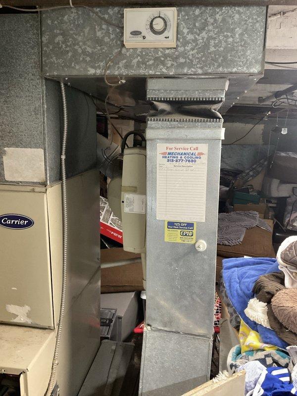 Provided comprehensive estimate for natural gas furnace replacement in basement utility area. Existing Carrier unit was condemned by DTE and is non-operational, requiring complete system replacement. Evaluated current installation including ductwork configuration, venting system with PVC condensate drain, electrical service panel connections, and thermostat controls to determine proper replacement specifications and scope of work.