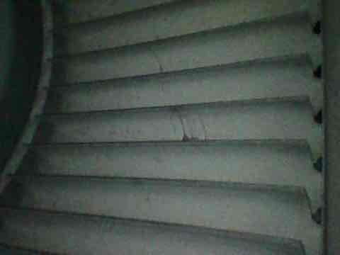 Responded to customer concern regarding inadequate cooling performance. Performed comprehensive system tune-up and inspection of HVAC unit. Examined condenser coil fins, which appeared clean and in good condition with proper spacing and no visible damage. Accessed equipment located in basement stairwell area. Completed full diagnostic evaluation to identify cause of reduced cooling capacity and verified system operation parameters.