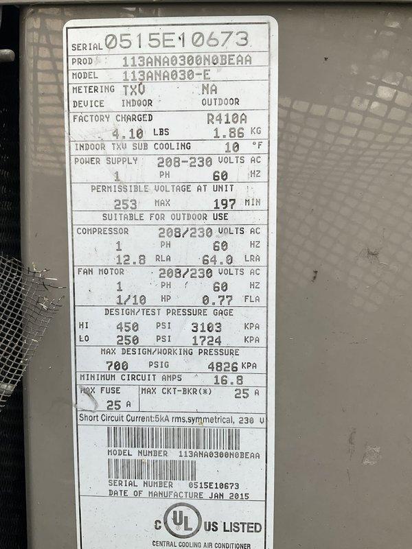 Responded to service call for thermostat displaying error code and remaining stuck on "782-689." Upon inspection, documented the outdoor condensing unit specifications, confirming system as a 2.5-ton R410A air conditioning unit manufactured in January 2015. Photographed unit nameplate showing model 113ANA030-E with proper refrigerant charge of 4.10 lbs and verified electrical specifications including 208-230V single-phase power supply with 25-amp maximum overcurrent protection. System thermostat issue resolved and unit returned to normal operation.