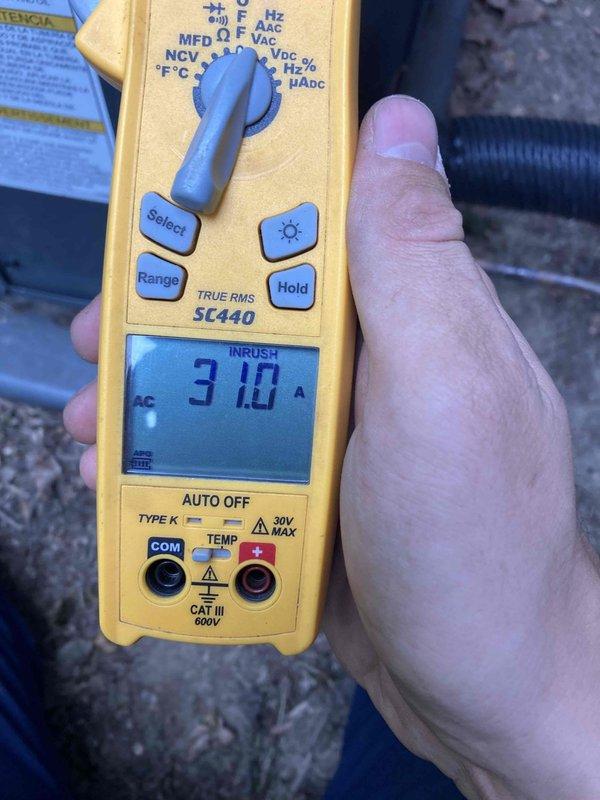 Completed routine AC maintenance tune-up on 2-year-old Goodman system. Performed comprehensive inspection of outdoor condensing unit, verified electrical measurements including amperage draw of 0.41A during operation and 3.10A inrush current, confirming normal operating parameters. All components found in proper working condition with no issues identified.