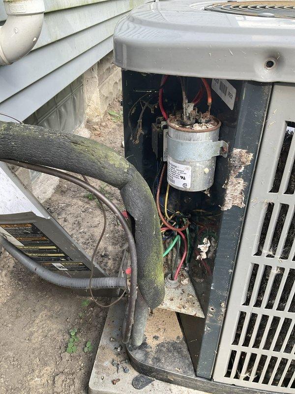 Responded to no cooling complaint with humming noise from outdoor unit. Upon inspection, found failed capacitor with visible corrosion at terminals and deteriorated refrigerant line insulation showing organic growth. Replaced defective capacitor, tested system operation, and restored cooling functionality.