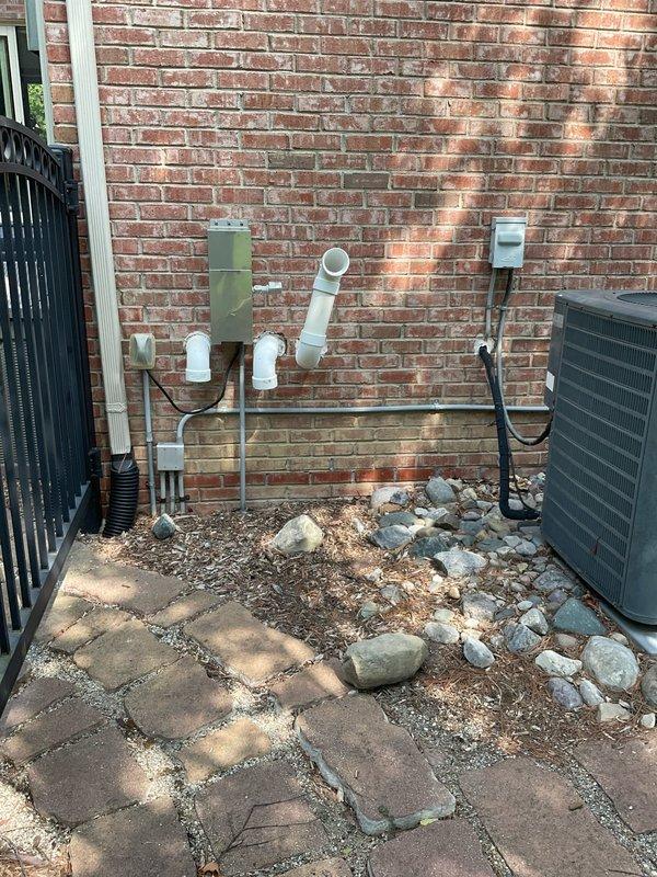 Completed estimate for full HVAC system replacement of 19-year-old non-operational Goodman furnace and outdoor condensing unit. Existing natural gas furnace located in basement mechanical room with current PVC venting configuration and outdoor condenser positioned against exterior brick wall on paver patio. Provided equipment specifications and installation recommendations for complete system upgrade to restore heating and cooling functionality.
