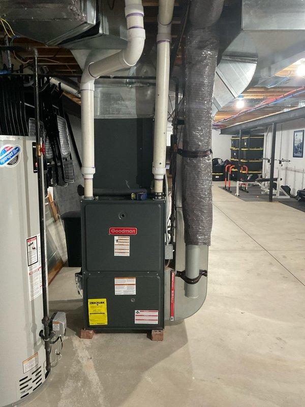 Completed estimate for full HVAC system replacement of 19-year-old non-operational Goodman furnace and outdoor condensing unit. Existing natural gas furnace located in basement mechanical room with current PVC venting configuration and outdoor condenser positioned against exterior brick wall on paver patio. Provided equipment specifications and installation recommendations for complete system upgrade to restore heating and cooling functionality.