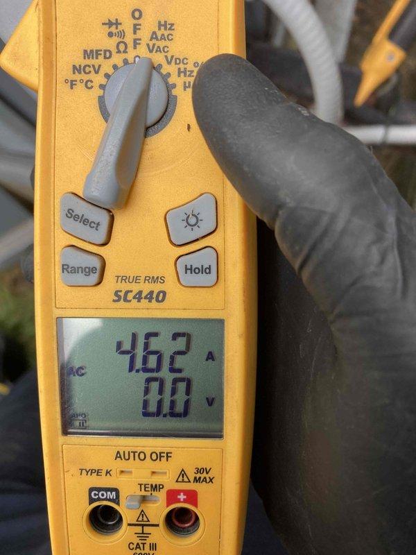 Completed scheduled Club AC10-2 preventive maintenance agreement visit on air conditioning system. Upon arrival, performed comprehensive system inspection and operational assessment. Measured electrical current draw at 46.2 amperes using calibrated clamp meter to verify compressor performance within manufacturer specifications. 

Inspected condenser unit interior, noting moderate dust and debris accumulation on evaporator coil fins and significant organic debris collection around compressor base. Observed copper refrigerant lines and electrical connections in serviceable condition with minor surface oxidation consistent with unit age. Verified capacitor mounting and connections secure. System operational at time of inspection with all components functioning as designed. Documented equipment condition with photographic evidence for maintenance records.