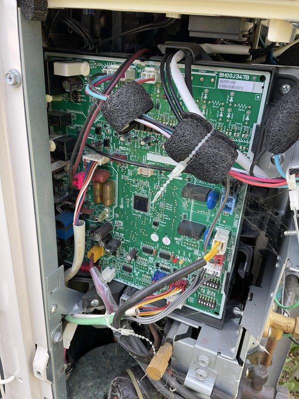 Completed prepaid preventive maintenance and tune-up on residential air conditioning system. Performed comprehensive inspection of outdoor condensing unit, including examination of control board assembly and internal electronic components. Verified proper operation of dual-stacked PCB control modules (BH00J347B/BH01D347B), inspected all wire harness connections and ribbon cable assemblies for secure termination and signs of heat damage or deterioration. Checked condition of foam insulation protecting wiring bundles and confirmed proper mounting of all circuit boards within control panel enclosure. Inspected mechanical components including valve assemblies and brass fittings at base of unit. All electrical connections found secure with no signs of corrosion or loose terminations. System operating within normal parameters with no deficiencies noted. Unit left in proper working condition.