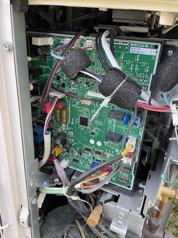 Completed prepaid preventive maintenance and tune-up on residential air conditioning system. Performed comprehensive inspection of outdoor condensing unit, including examination of control board assembly and internal electronic components. Verified proper operation of dual-stacked PCB control modules (BH00J347B/BH01D347B), inspected all wire harness connections and ribbon cable assemblies for secure termination and signs of heat damage or deterioration. Checked condition of foam insulation protecting wiring bundles and confirmed proper mounting of all circuit boards within control panel enclosure. Inspected mechanical components including valve assemblies and brass fittings at base of unit. All electrical connections found secure with no signs of corrosion or loose terminations. System operating within normal parameters with no deficiencies noted. Unit left in proper working condition.