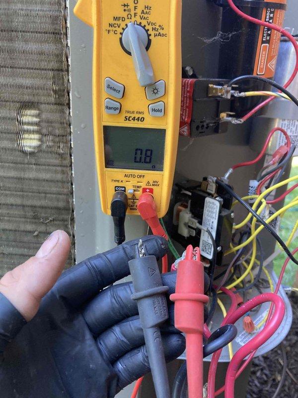 Completed routine AC tune-up on 7-year-old outdoor condensing unit. Performed electrical diagnostics using digital multimeter to verify system voltage and amperage readings across contactor and capacitor terminals. All electrical components tested within normal operating parameters. Cleaned both interior and exterior surfaces of unit as requested, including condenser coil fins and electrical compartment. System operating efficiently with no issues found during inspection.