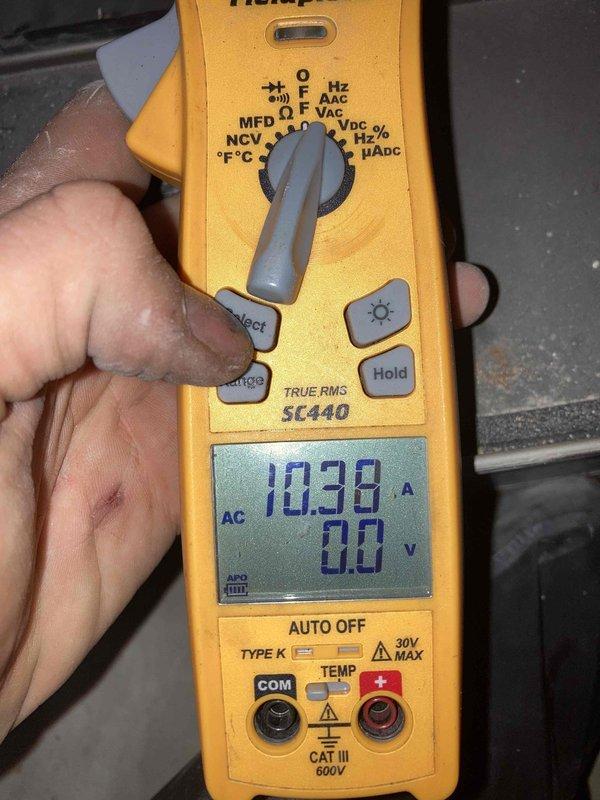 Performed cooling system tune-up and maintenance on properly functioning HVAC unit. Cleaned condenser coil to restore optimal airflow and heat transfer efficiency. Conducted comprehensive electrical diagnostics using digital multimeter, verifying capacitor functionality and measuring system amperage at 10.38A with proper voltage readings, confirming all electrical components operating within manufacturer specifications.