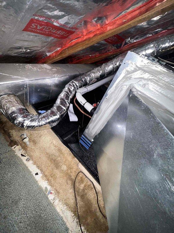 Completed installation of Unico air handler system in attic space with all mechanical and electrical connections. Unit was properly positioned, secured, and connected to flexible ductwork distribution system, with system testing performed using refrigerant manifold gauges confirming proper pressures and operational parameters. Final reconnection and commissioning verified system is operating within manufacturer specifications.