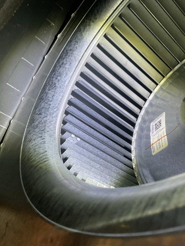 Completed scheduled CLUB AC 8-12 preventive maintenance agreement visit for air conditioning and system inspection. Performed comprehensive system evaluation including inspection of blower wheel assembly, which showed normal operational condition with minor dust accumulation on housing, and verified proper airflow through flexible ductwork connections at main junction point. All components photographed and documented for maintenance records, with system operating within manufacturer specifications at time of service.