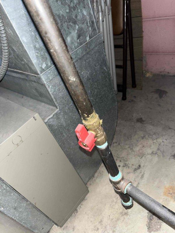 Responded to no cooling complaint on 10-year-old residential AC system where outdoor fan was running but no airflow was present inside the home after system had been off for 1.5 days. Upon arrival, performed visual inspection of outdoor unit and indoor air handler components. Examined refrigerant lines, electrical connections, and ductwork for obvious signs of damage or disconnection. Checked blower motor operation and verified proper voltage supply to indoor unit. Inspected air filter condition and confirmed adequate return air pathway. Tested thermostat functionality and verified proper communication between control board and system components. Documented system condition with photos of outdoor unit location and indoor mechanical components including copper refrigerant lines, shutoff valve, and ductwork connections. System evaluated for potential blower motor failure, control board malfunction, or ductwork separation given symptom of outdoor unit operation without corresponding indoo
