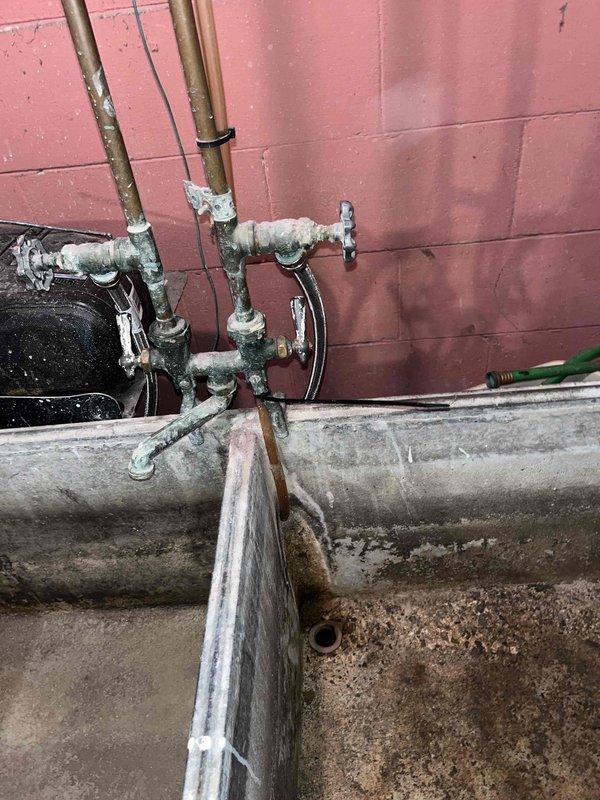 Responded to a no cooling complaint on a 10-year-old residential air conditioning system where the outdoor fan was spinning but no airflow was present inside the home after the unit had been off for 1.5 days. Conducted a comprehensive system evaluation of both the outdoor condensing unit and indoor air handling components. Assessed the outdoor unit condition, electrical connections, refrigerant circuit, and compressor operation while documenting the existing equipment installation and associated plumbing infrastructure. Provided the customer with a detailed estimate for complete HVAC system replacement due to the age and condition of the existing equipment.