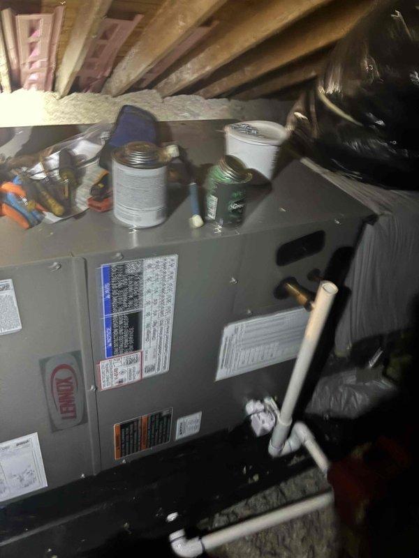 Completed installation of Lennox air handler unit in attic space with all necessary refrigerant line connections, condensate drainage system using white PVC piping, and proper integration with existing ductwork. Unit was positioned on stable platform, all electrical connections made per manufacturer specifications, system tested and verified operational with appropriate airflow.