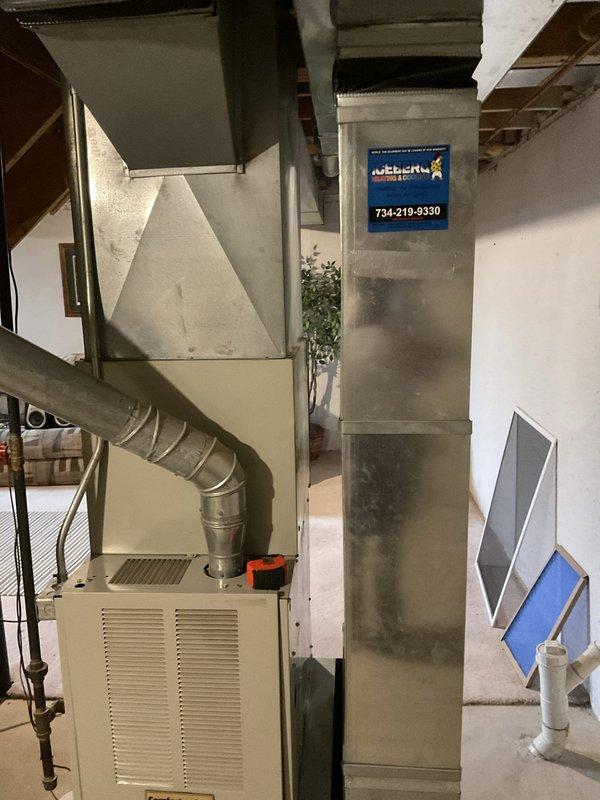 Conducted comprehensive system evaluation and discovered failed heat exchanger and frozen evaporator coil in existing furnace and air conditioning system. Documented current equipment condition with detailed photos of basement installation, including furnace cabinet, ductwork configuration, and surrounding mechanical components. Provided complete system replacement estimate to address both heating and cooling failures.