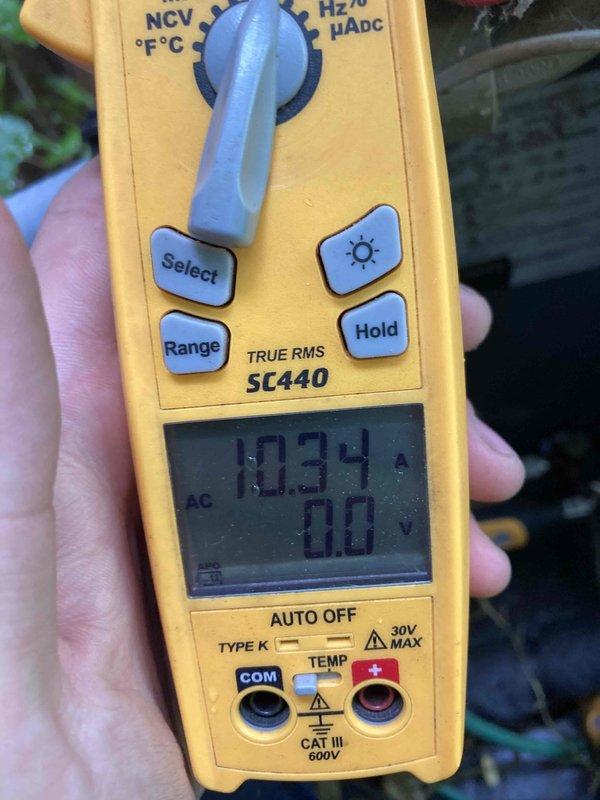 Completed prepaid annual AC tune-up and preventative maintenance inspection on residential air conditioning system. Inspected and replaced heavily soiled air filter showing significant particulate accumulation and debris buildup that was restricting airflow. Performed electrical diagnostics using digital multimeter, verified system amperage draw at 10.34A and confirmed proper voltage readings. Conducted comprehensive system evaluation including refrigerant levels, condensate drain operation, thermostat calibration, and overall unit performance. System operating within normal parameters following maintenance completion with no deficiencies noted.