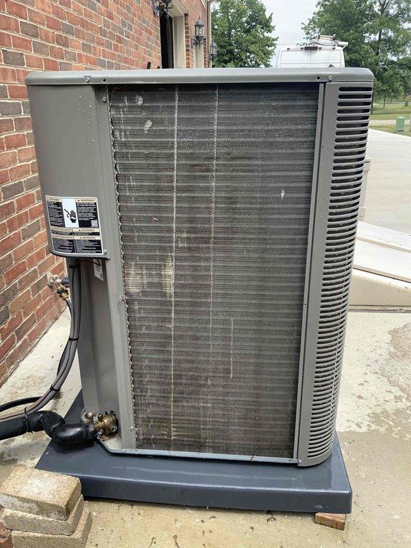 Completed prepaid annual AC tune-up maintenance on residential outdoor condensing unit as part of membership benefit. Performed standard inspection of electrical components including capacitor, wiring connections, and contactors—all found in proper working condition. Inspected condenser coils which showed moderate accumulation of dust and debris between fins; cleaned coils to restore optimal airflow and heat transfer efficiency. Verified refrigerant lines, confirmed secure electrical connections, and documented system operation. Unit operational with no issues identified.