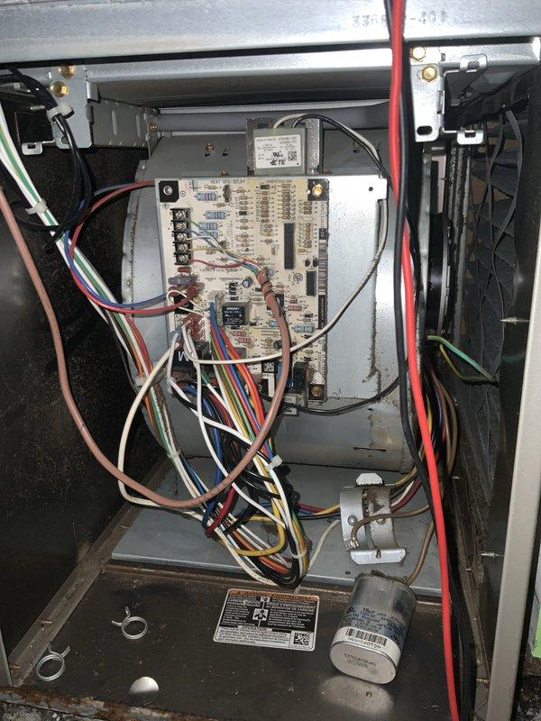 Responded to no cooling complaint affecting entire home. Upon arrival, performed diagnostic evaluation of outdoor air conditioning unit and indoor air handler. Removed access panels and inspected electrical components including capacitor, contactor, and control board connections. Used multimeter to test voltage and continuity across system components. Verified all wire connections at control board and electrical terminals were secure. Inspected capacitor for proper function and checked contactor operation. Examined control board for signs of failure or damage. All components tested within normal operating parameters with no defects found. System restored to normal cooling operation.