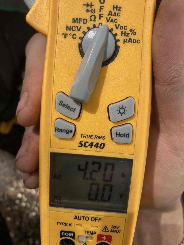 Completed prepaid air conditioning tune-up and maintenance inspection on residential AC system. Performed comprehensive system evaluation including blower assembly inspection, which revealed significant dust and debris accumulation on squirrel cage fan blades requiring attention for optimal airflow. Conducted electrical diagnostics using digital multimeter to verify system voltage and amperage readings, confirming proper electrical operation at 420 volts with stable performance parameters. All routine maintenance procedures completed with no operational issues identified; system running within manufacturer specifications.